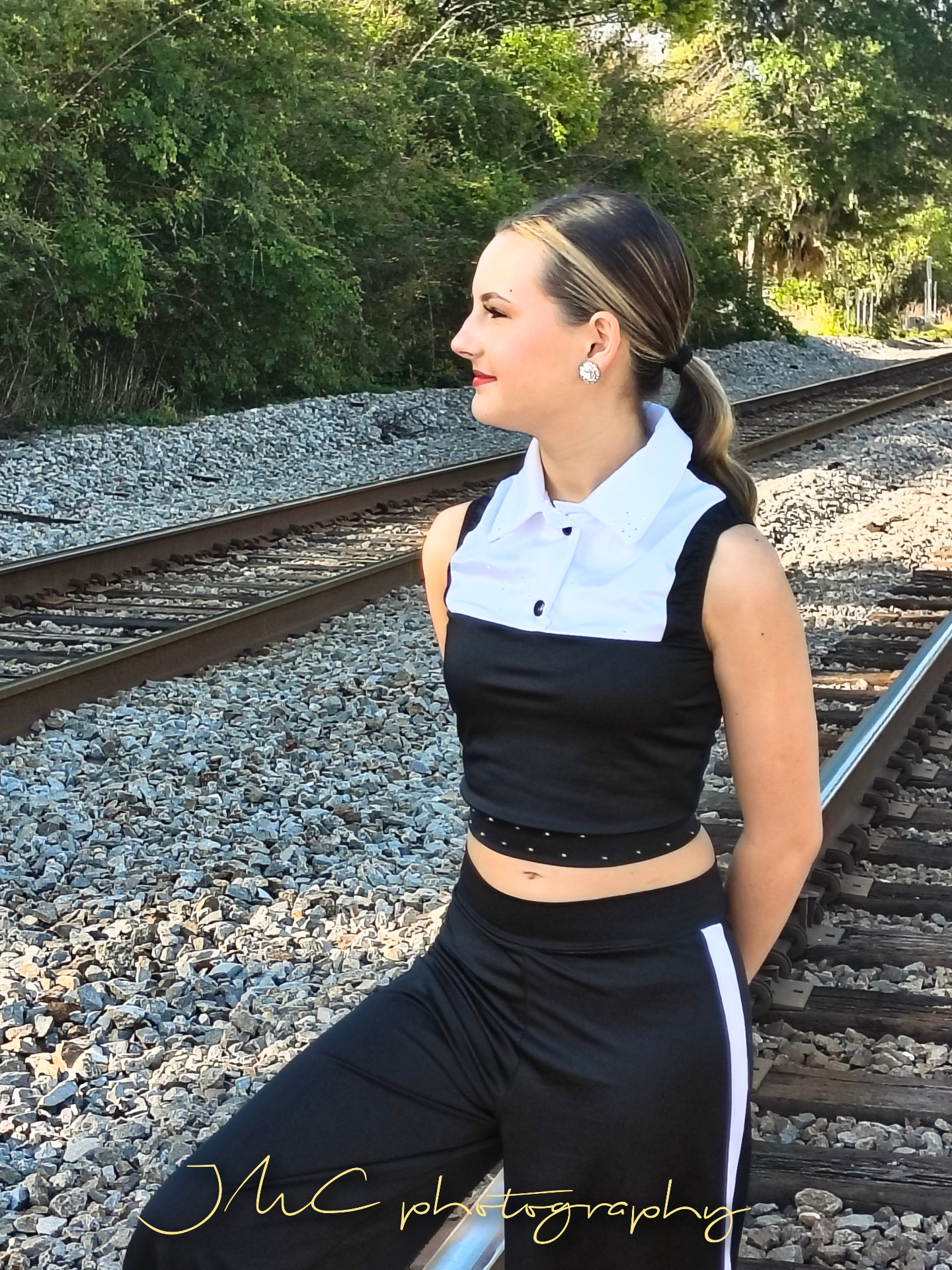 Senior portrait by the railroad tracks