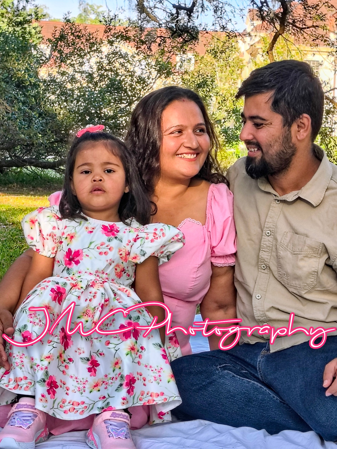 Family of three under the oak trees